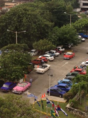 A more typical mix of cars in the hotel parking lot. ...